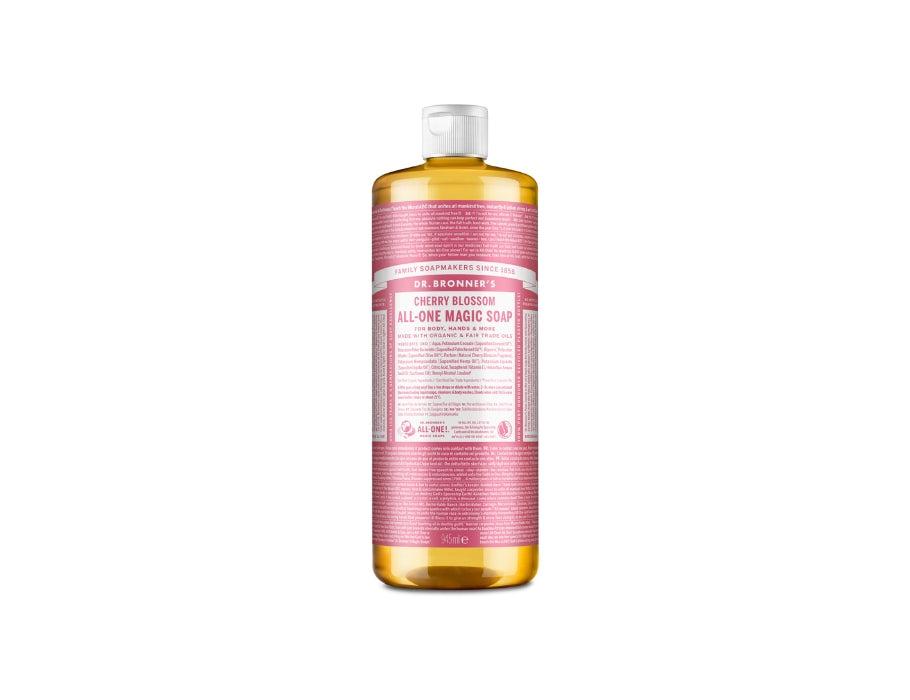 Extra grote transparante fles Dr. Bronner’s Cherry Blossom All-One Magic Soap met roze label en witte dop; biologische vloeibare zeep van 946 ml.
