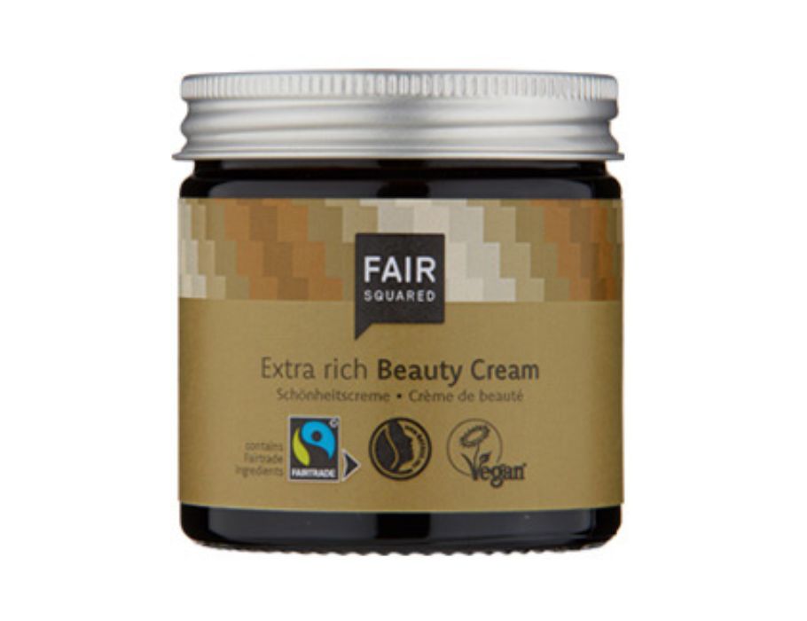 Fair Squared Extra Rich Beauty Cream in een donkere glazen pot met zilveren deksel en beige etiket; voedende fairtrade en vegan gezichtscrème.