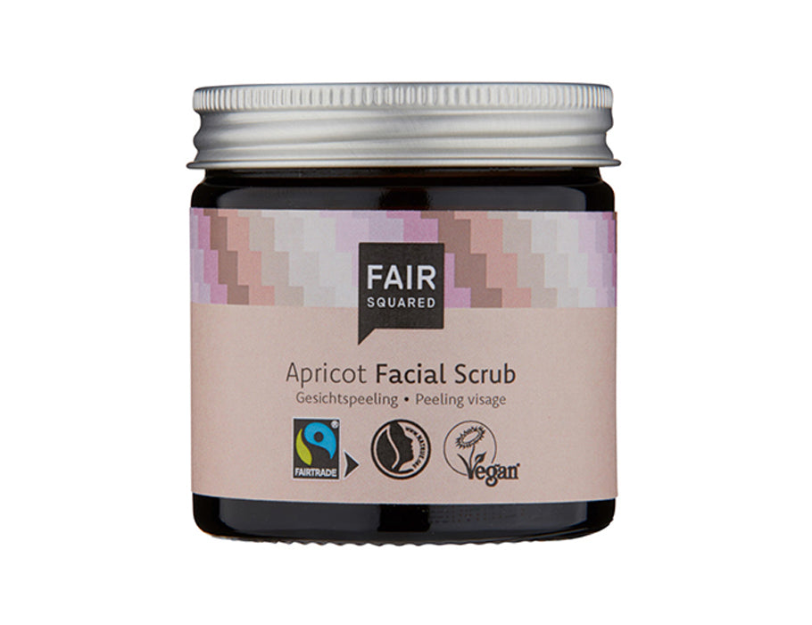 Fair Squared Apricot Facial Scrub in een amberkleurig glazen potje met zilveren deksel en lichtroze etiket; fairtrade en vegan gezichtsscrub.