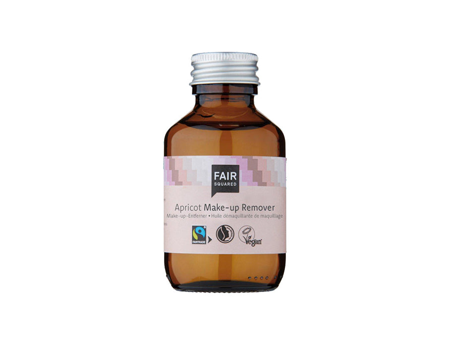 Fair Squared Apricot Make-up Remover in een amberkleurige glazen fles met zilveren schroefdop en lichtroze etiket; Fairtrade en vegan gezichtsreiniger.