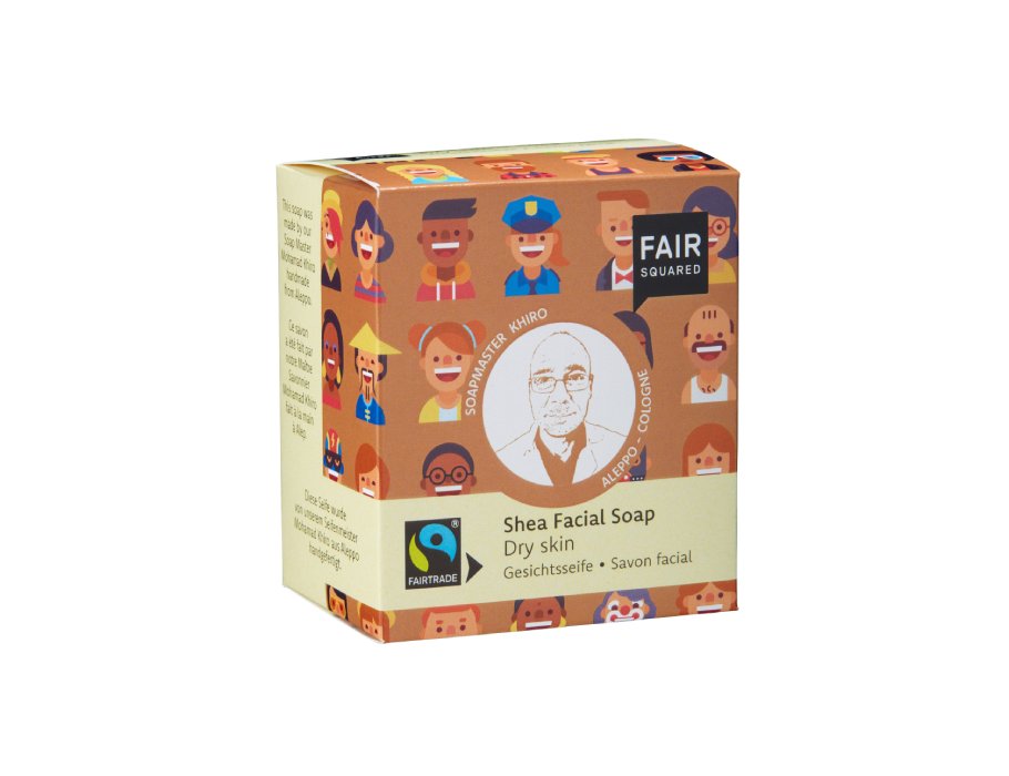 Fair Squared Shea Facial Soap voor droge huid in een bruine kartonnen verpakking met kleurrijke illustraties van diverse gezichten; fairtrade en vegan gezichtszeep.