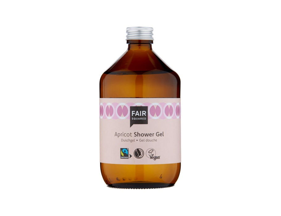 Fair Squared Apricot Shower Gel in een amberkleurige glazen fles met zilveren dop en lichtroze etiket; fairtrade en vegan douchegel met abrikoos.